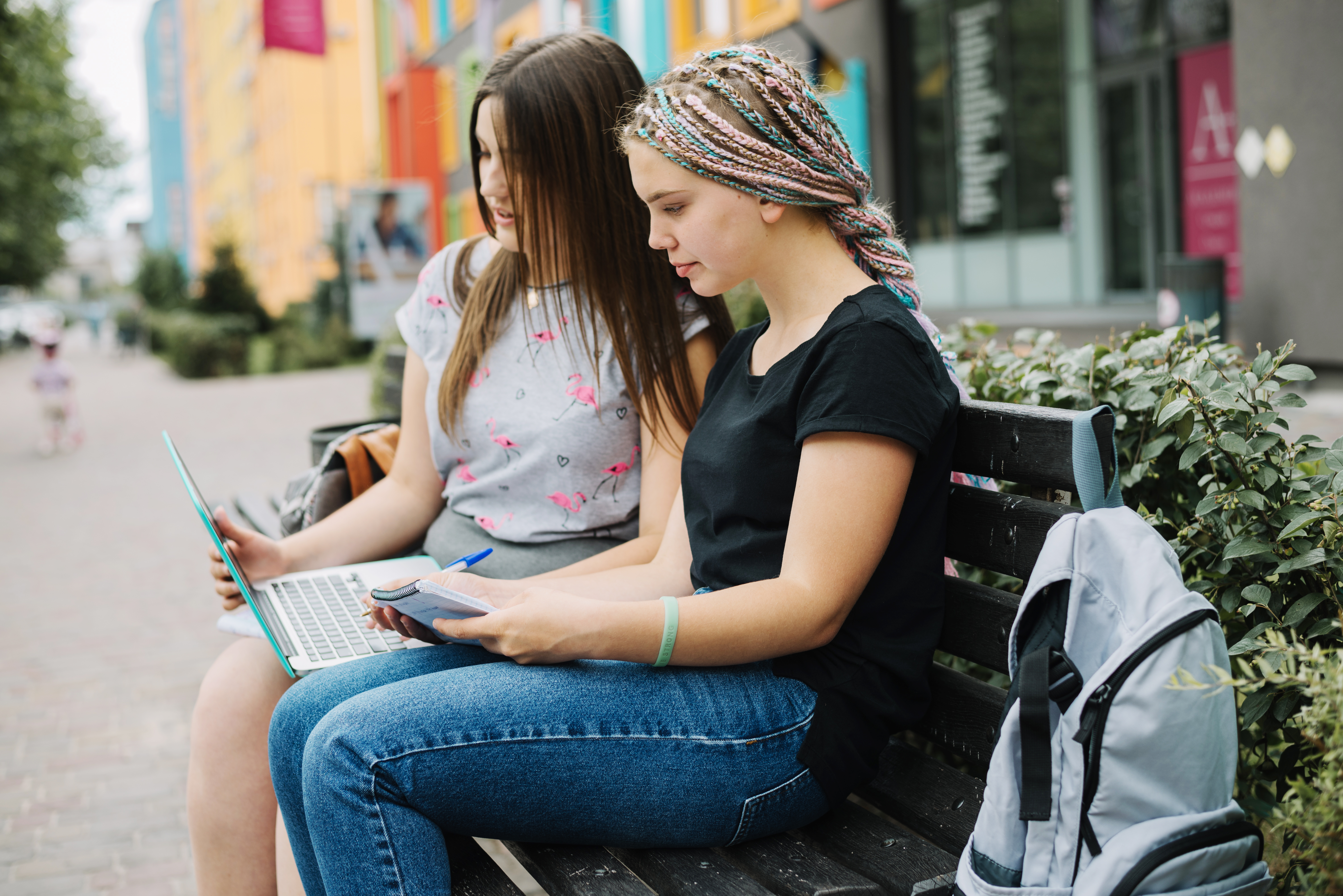 schoolgirl studying bench